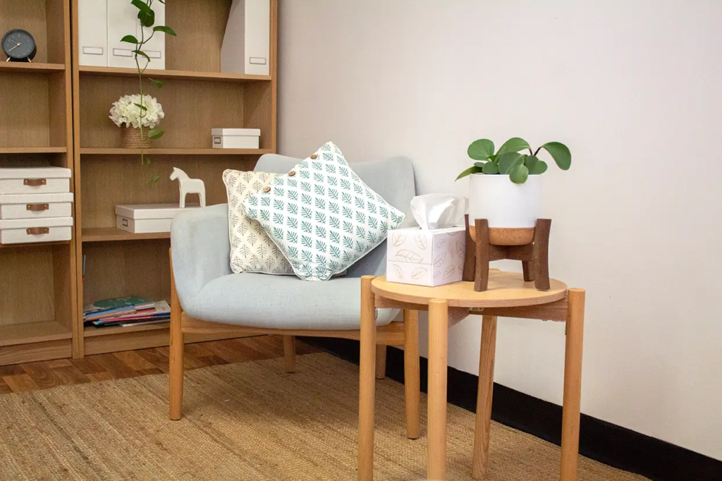 A quiet, modern consultation room with chairs and a desk for private assessments.