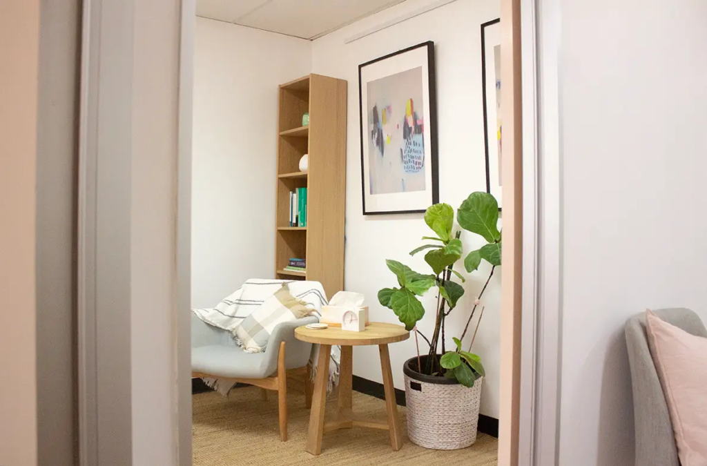 A quiet, professional, and well-lit consultation desk inside the clinic, arranged for private clarity and insight.